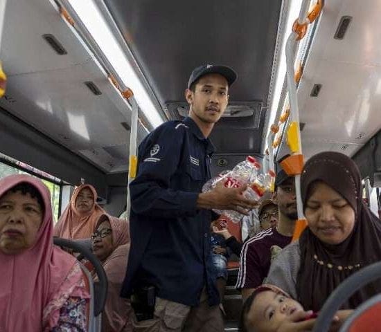 An hour-long bus ride with unlimited stops costs three large bottles, five medium bottles or 10 plastic cups in an Indonesian re